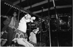 gilbert riding the carousel